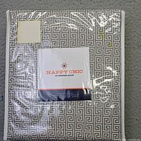 Front view of sealed Happy Chic by Jonathan Adler sheet set package
