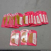 All 15 packaged heel and comfort grips laid out