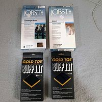 Front view of all four boxed support socks