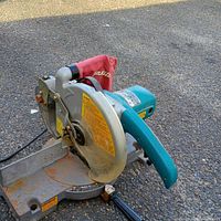 Overall view of Makita 10-inch miter saw on pavement