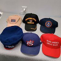 Group shot of six hats