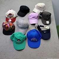 Group shot of all ten caps laid out for overview