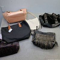 All six handbags spread out for overview