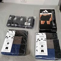 All four sealed underwear packs arranged on surface