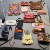 All 14 handbags laid out for overview