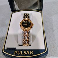 Pulsar wristwatch in branded box showing watch face and bracelet