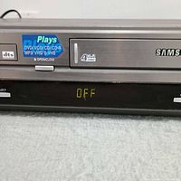 Front close-up showing brand, Plays logo, Hi-Fi label, display lit