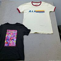 Both t-shirts laid flat