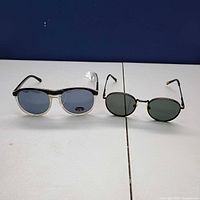 Both pairs of sunglasses side by side