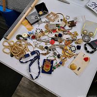 Overview of entire mixed jewelry spread on table