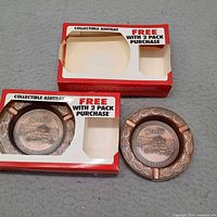 Two ashtrays with their original boxes