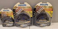 Three sealed Philips PX1000 cable packs: two component video + audio, one S-Video + audio