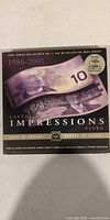 Front of Lasting Impressions collector set sleeve showing $10 note image and date range 1986-2001