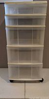 Front view of 5-drawer plastic cart on wheels