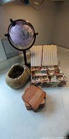 All items in lot: globe, trinket box open, acorn planter, wooden coasters stack