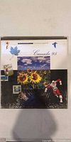 Front of shrink-wrapped Canada 95 stamp collection book