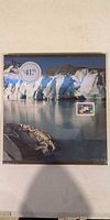 Front of sealed Canada Post Collection Canada 2000 yearbook showing $41.95 price sticker and glacier image