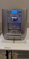 Front of Strauss Water countertop dispenser showing controls, display, spout and drip tray