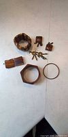 All six wooden jewellery items laid out