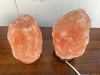 Both salt lamps side by side on table