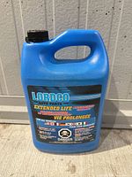 Front view of sealed blue 3.78 L jug showing brand and product information