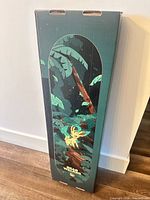 Front of sealed box showing Leafeon graphic on skateboard deck