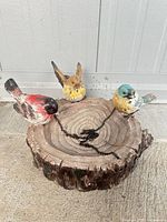 Overall view of resin bird bath with three birds