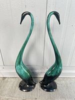 Front view of both Blue Mountain Pottery bird figurines standing together