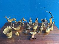 Group view of all brass and metal items on tabletop