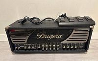 Front view of Bugera 333XL amp head with footswitch on top and power cord