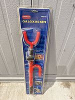 Front view of sealed package showing American car lock and keys