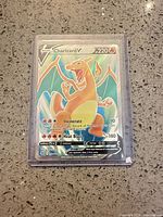 Front view of Charizard V card in plastic holder