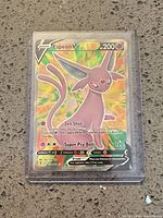 Front view of Espeon V card in sleeve