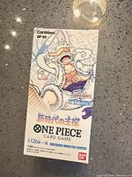 Front view of sealed Japanese One Piece OP-05 booster box showing artwork and Bandai branding