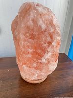 Front view of entire salt lamp on base