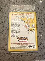 Front of sealed Legendary Birds promo card displaying Zapdos artwork and promotional text