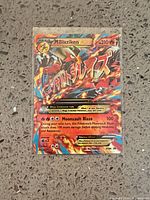 Front of Mega Blaziken EX XY86 holo promo card in sleeve