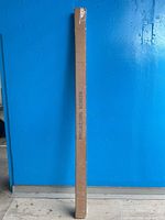 Full length of sealed cardboard box marked 'PROJECTION SCREEN'