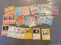 Spread showing full group of roughly 29 Pokémon cards