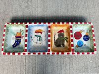 Top view of rectangular ceramic serving dish showing four compartments with Christmas designs