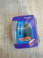 Front view showing model WM-FS191, tuner scale, purple casing and logos