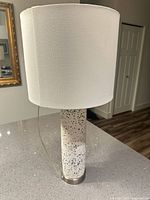 Full view of table lamp with shade