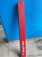 Full view of red Tinybot Vinyl box standing upright