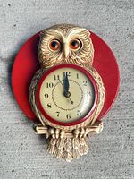 Front view of complete owl wall clock showing color, shape and overall condition