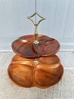 Full view of two-tier wooden divided tray showing brass handle and top/bottom tiers