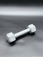 Top view of single gray 5 lb hex dumbbell