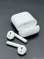 Charging case open with two earbuds displayed