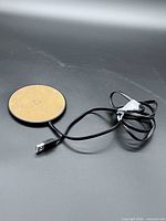 Top view of BlueHive wireless charging pad and attached USB-A cable
