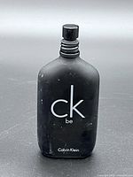 Front of Calvin Klein CK Be bottle showing logo and spray top