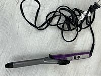 Full view of curling iron with cord